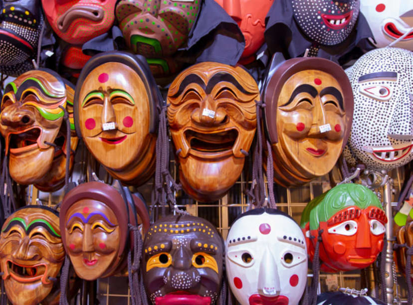 Traditional carved and painted Korean masks hanging in a store in Insa-dong, Seoul.