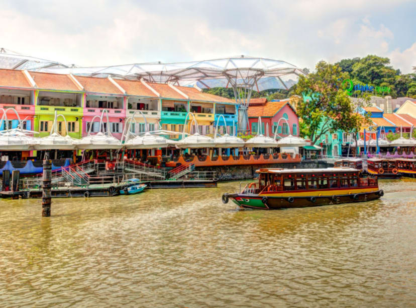 Colored warehouses and bumboat on the river at Clarke Quay in Singapore