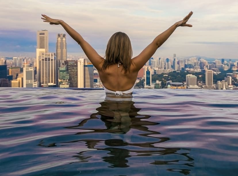 Looking over the Singapore skyline from a rooftop infinity pool