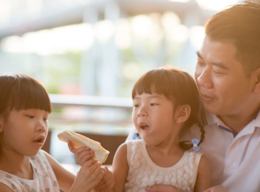 Young family eating lunch together