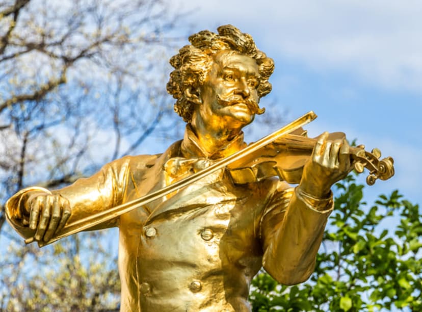 Golden statue of Johann Strauss II in Vienna's Stadtpark.