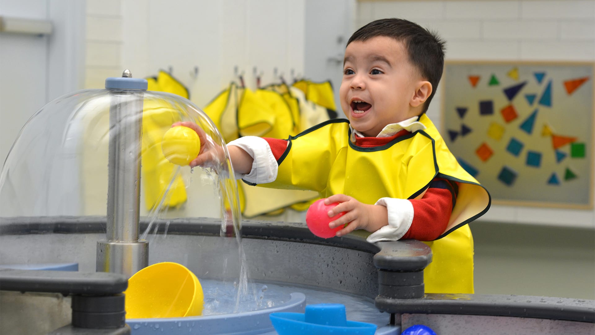 Child Playing with Water Toy At Boston Children's Museum