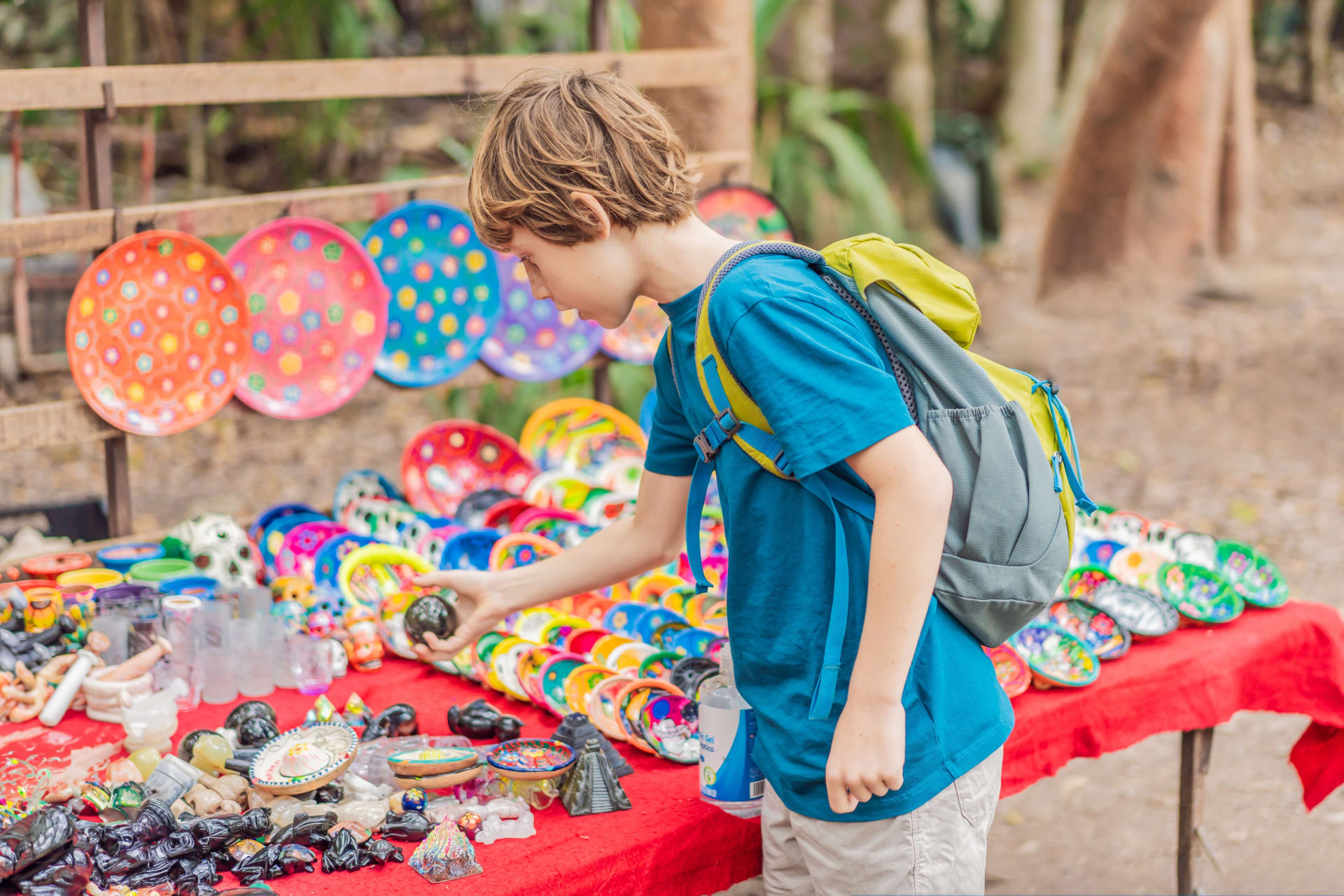 boy-buying-mexican-souvenirs-market