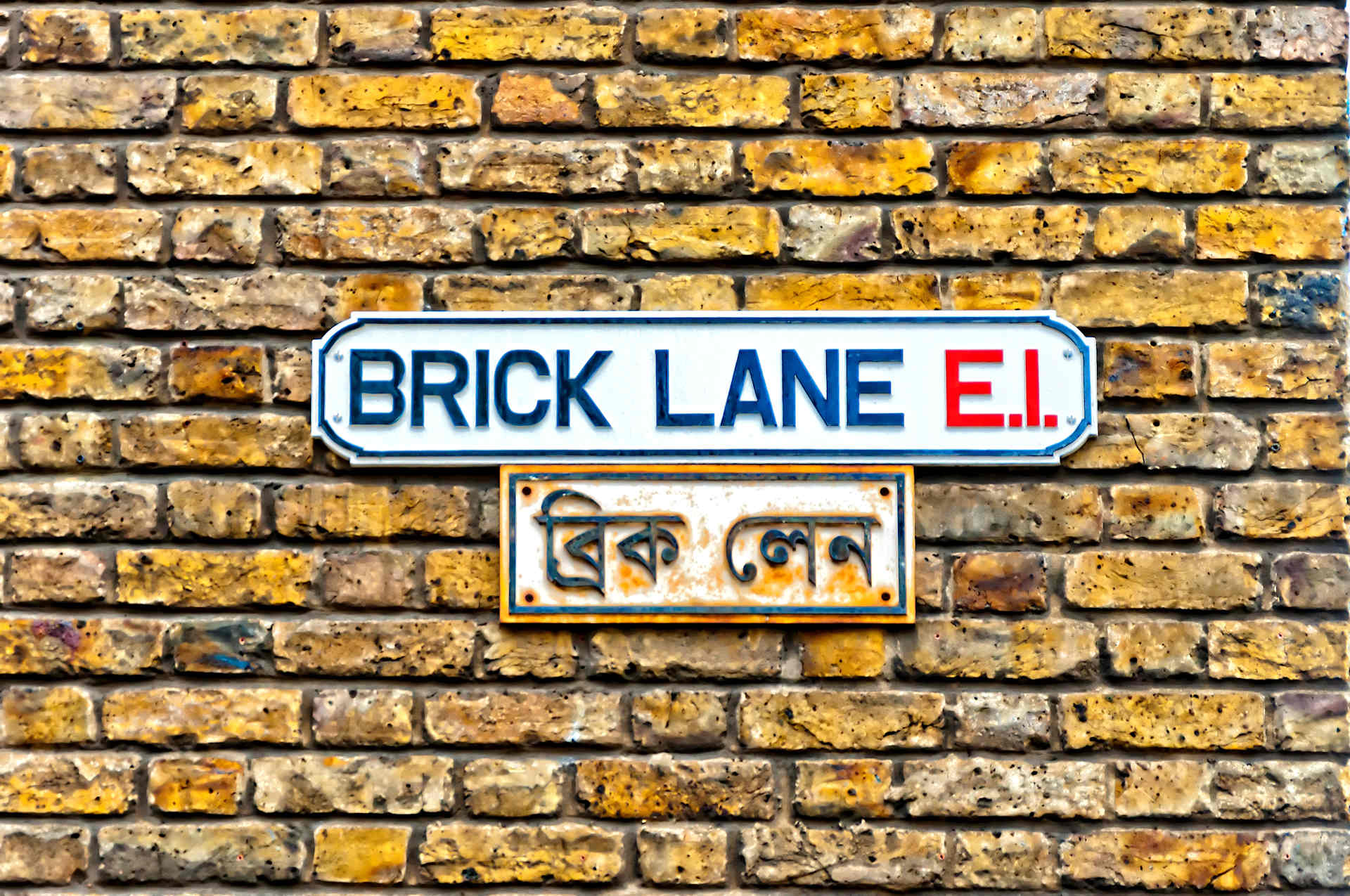 brick lane street sign on a wall in shoreditch london