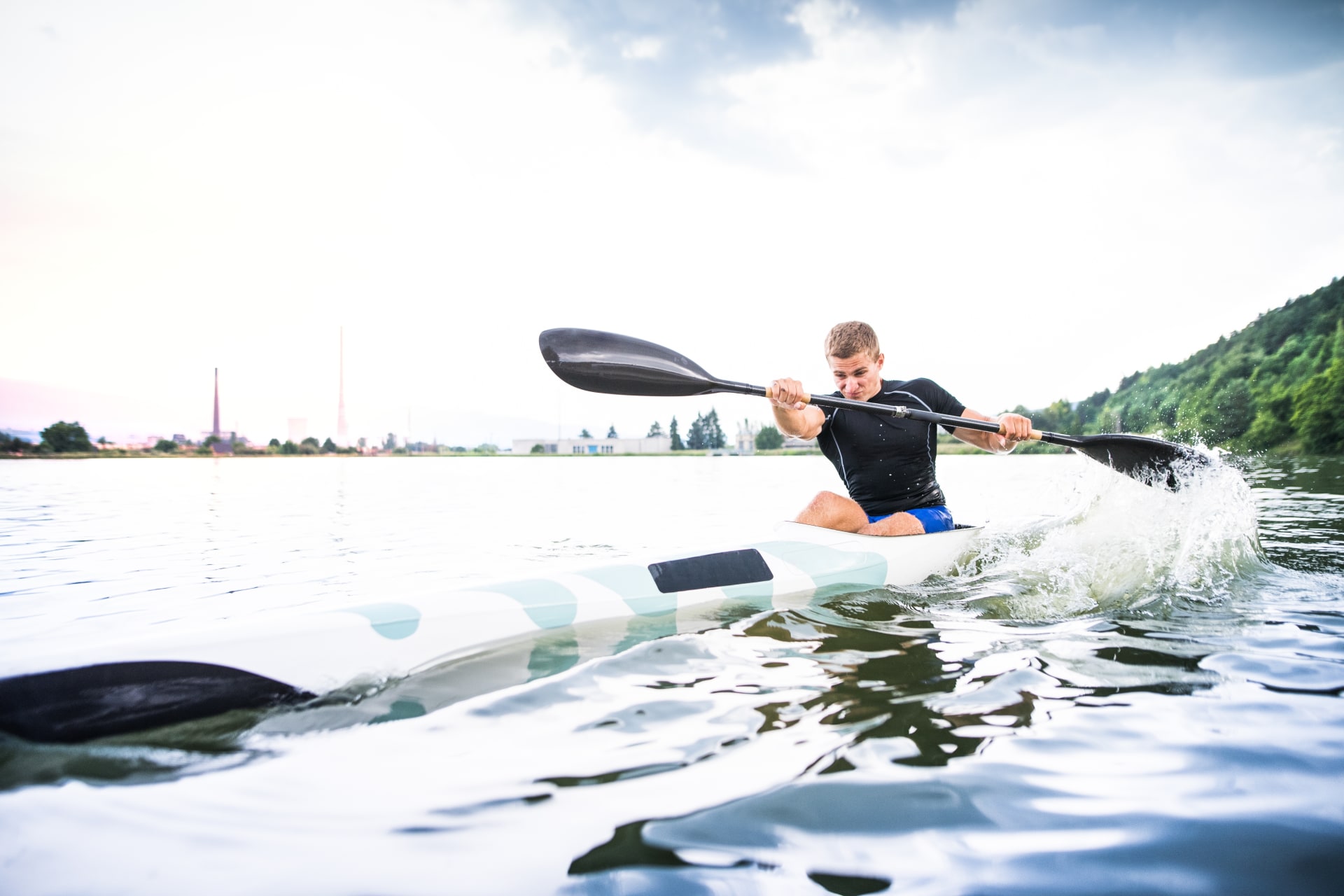 canoeist-man-sitting-canoe-holding-paddle
