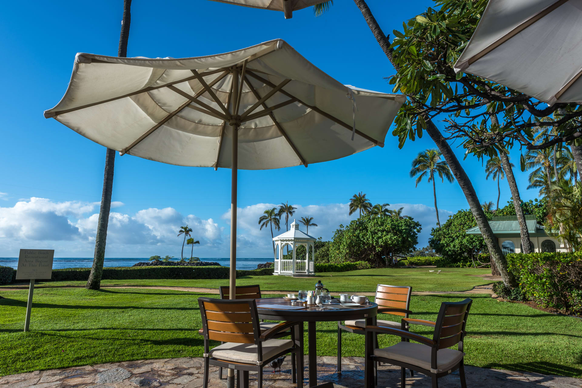 early-morning-breakfast-table-under-umbrella
