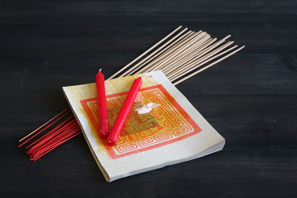 Candles and joss sticks for the Yu Lan Cultural Festival