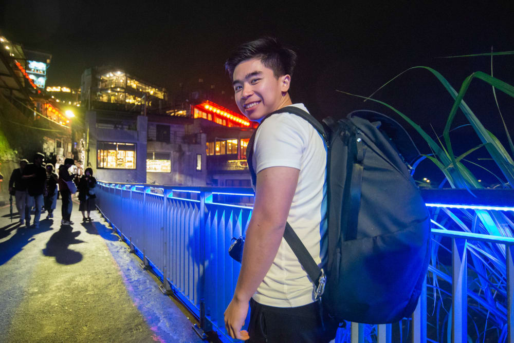 Solo backpacker exploring Hong Kong at night