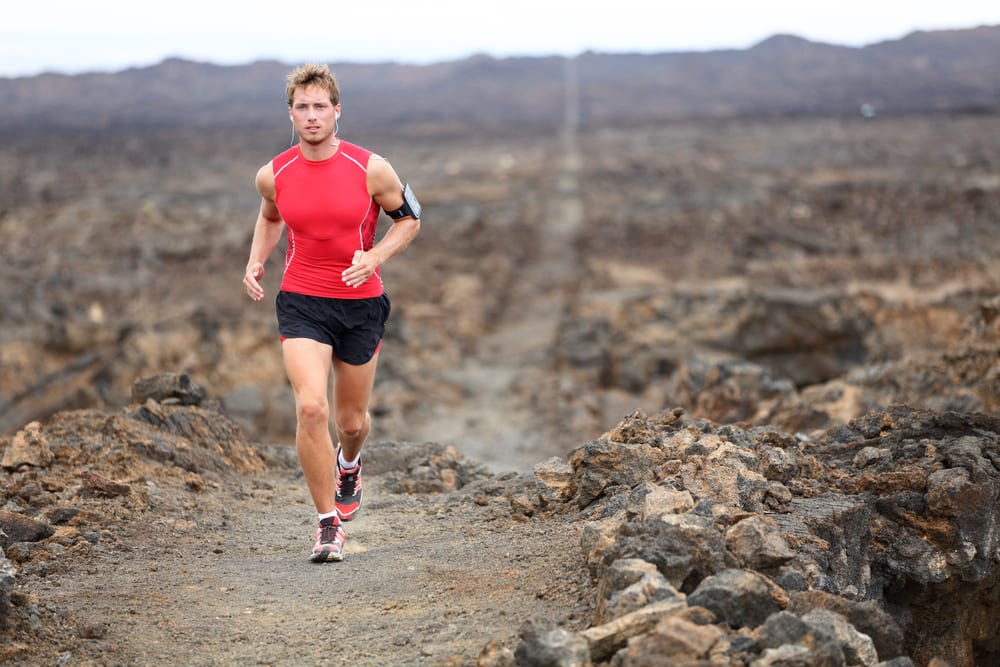 Traithlon competitor running trails on Hawaii's Big Island
