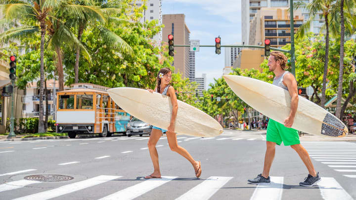 Surfers crossing the road in Honolulu