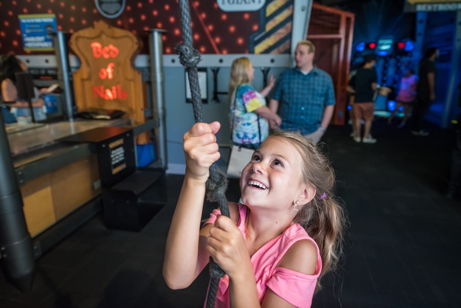 Image of girl smiling while holding pulley ropes