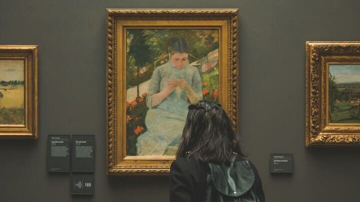Woman admiring art in Musée d'Orsay