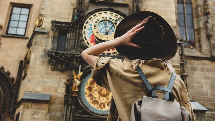 Woman looking at the Astronomical Clock on Prague's Old Town Square