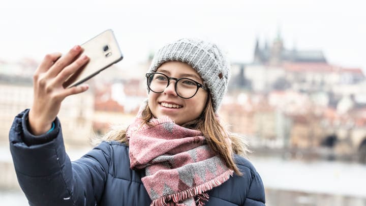 Young woman taking a selfie in Prague