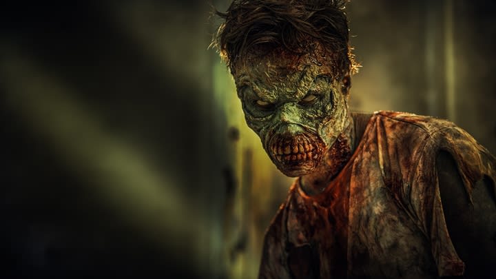 Escape room actor posing as a zombie