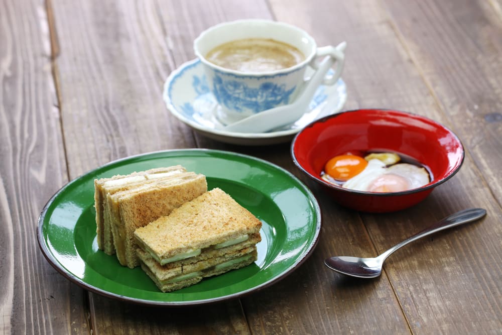 Classic Singapore breakfast of kaya toast, eggs and coffee