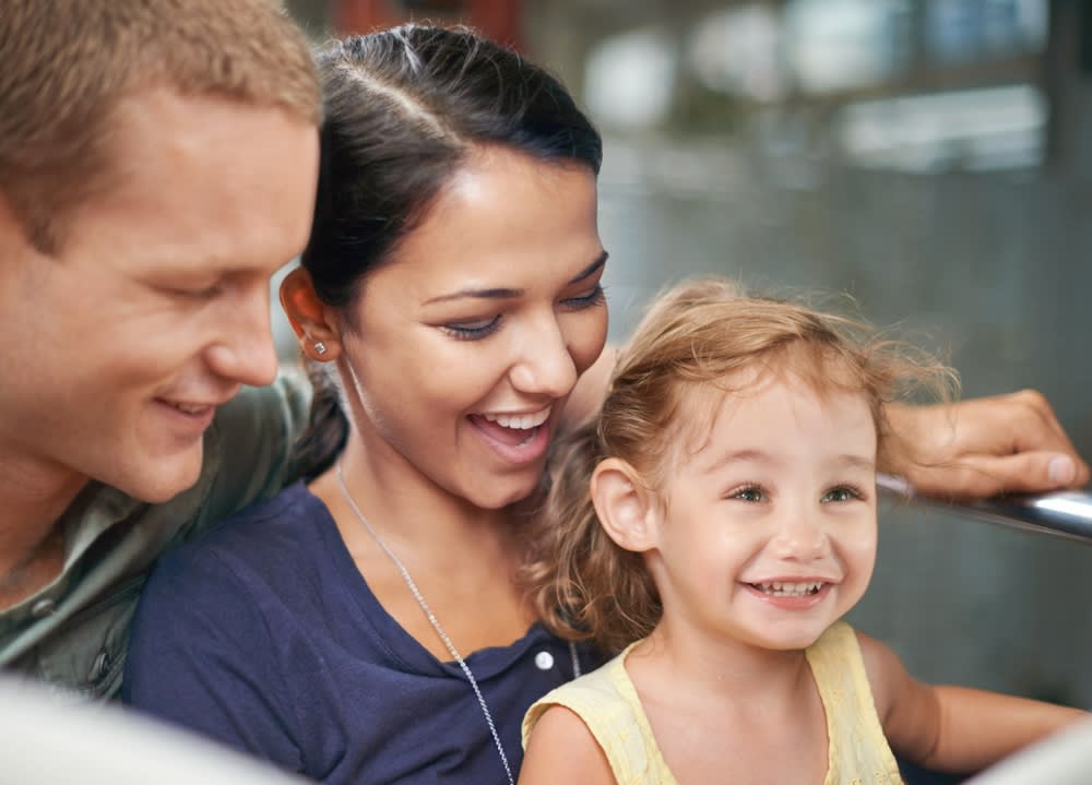 Young family having fun at an amusement park