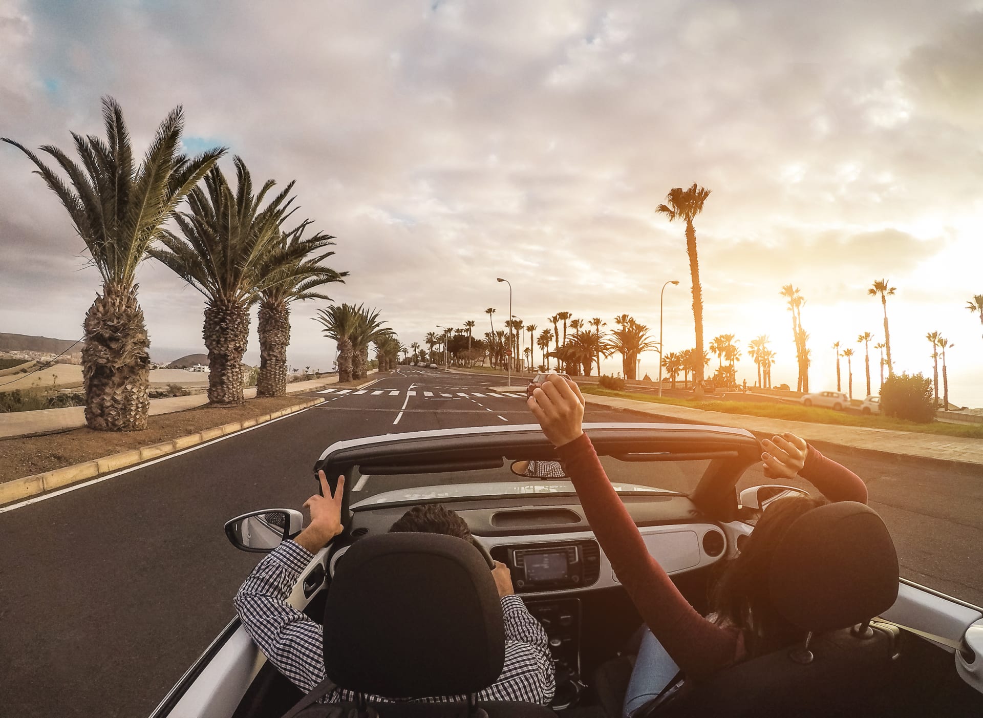 happy-people-having-fun-convertible-car