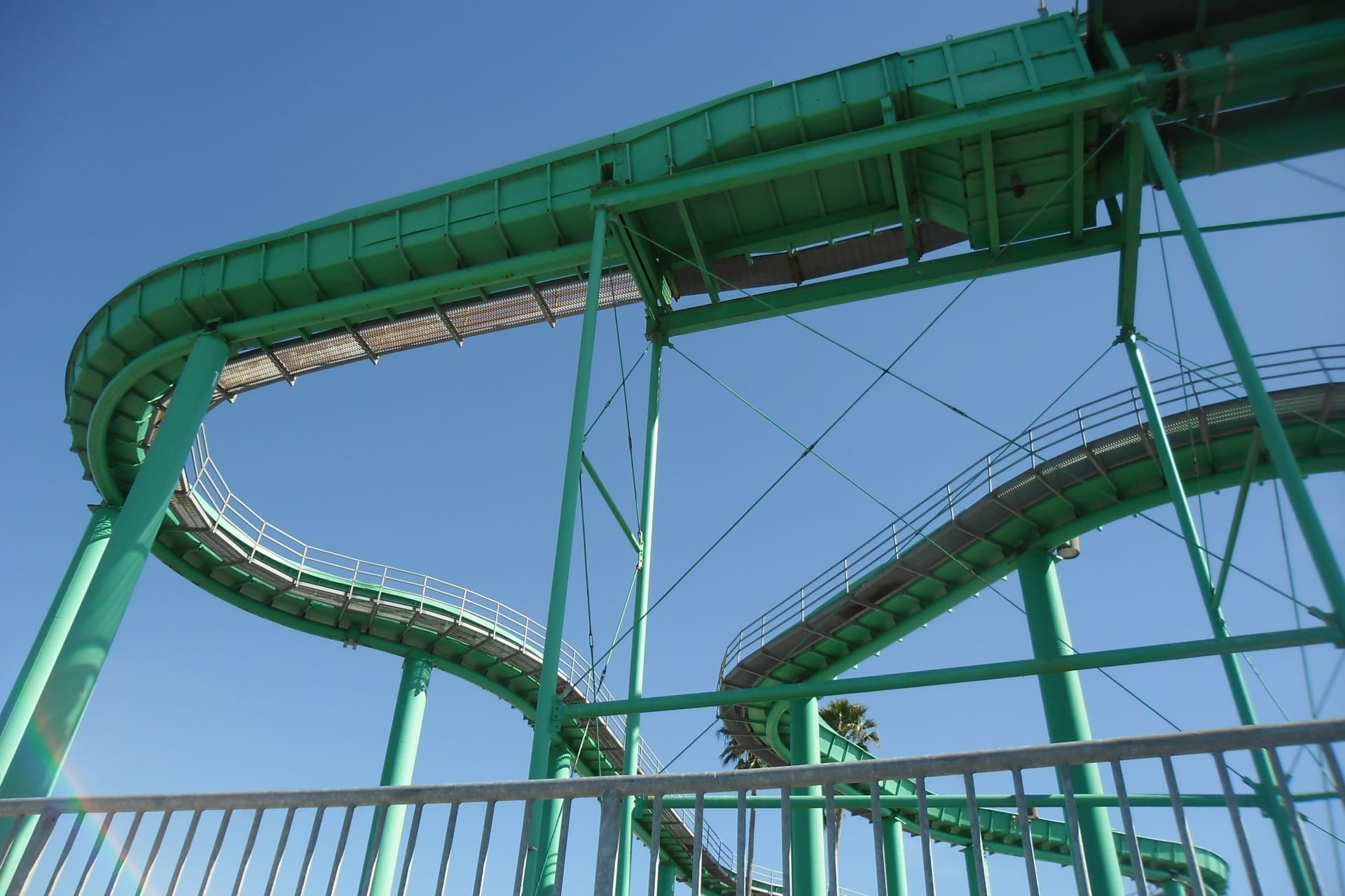 low-angle-view-looking-empty-green-roller-coaster