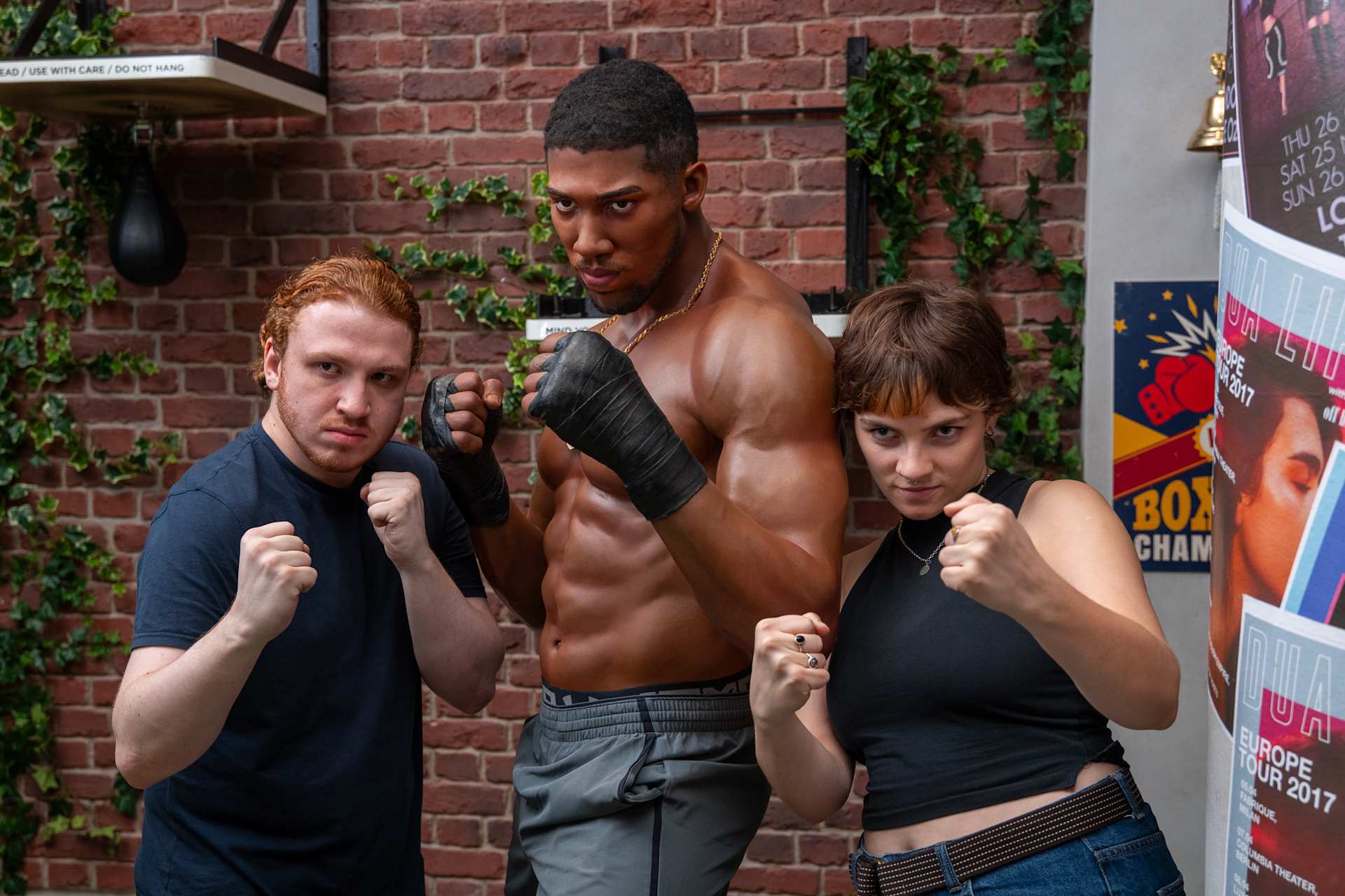 Friends Posing with Anthony Joshua at Madame Tussauds
