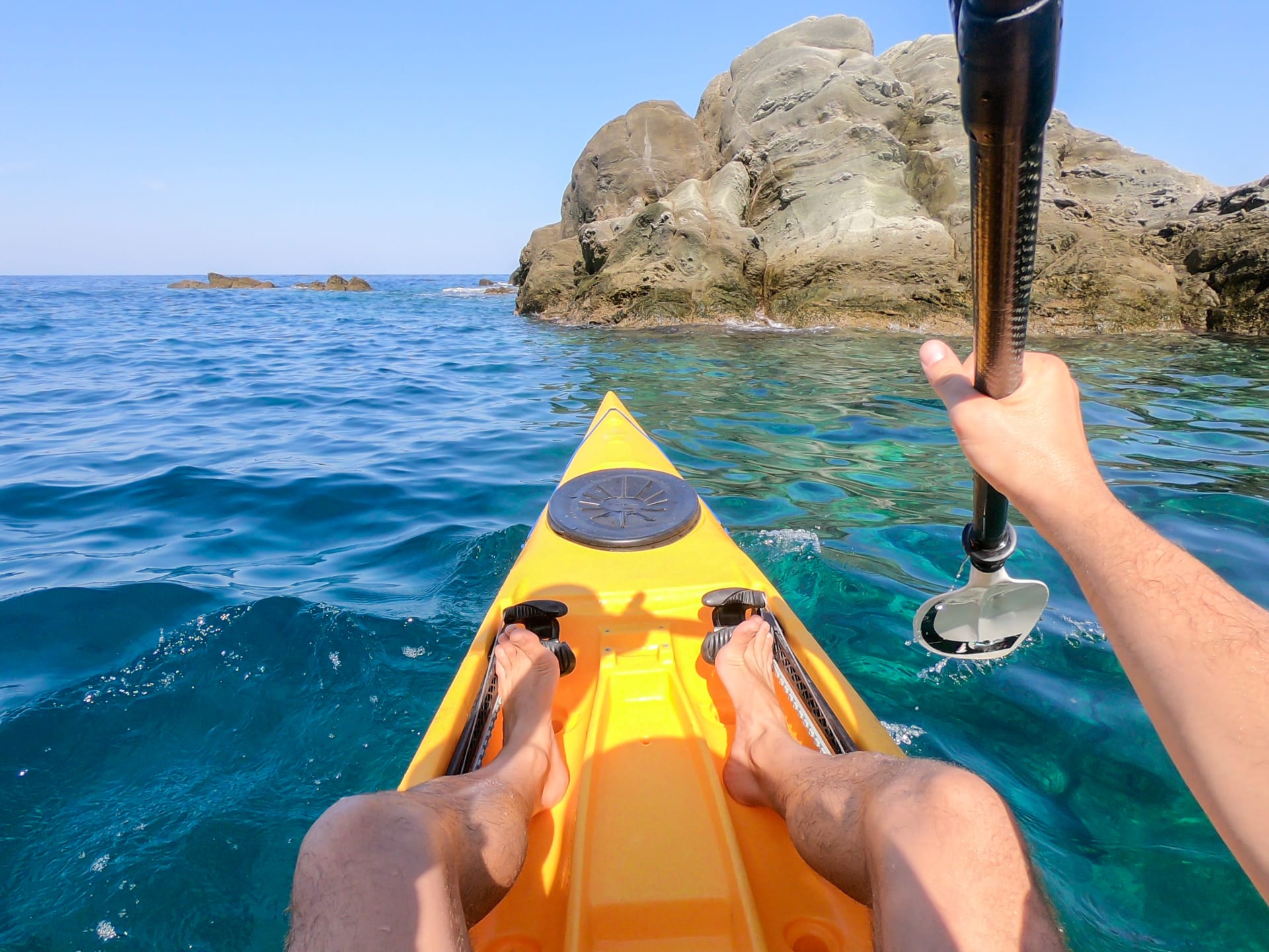 pov-man-floating-yellow-kayak