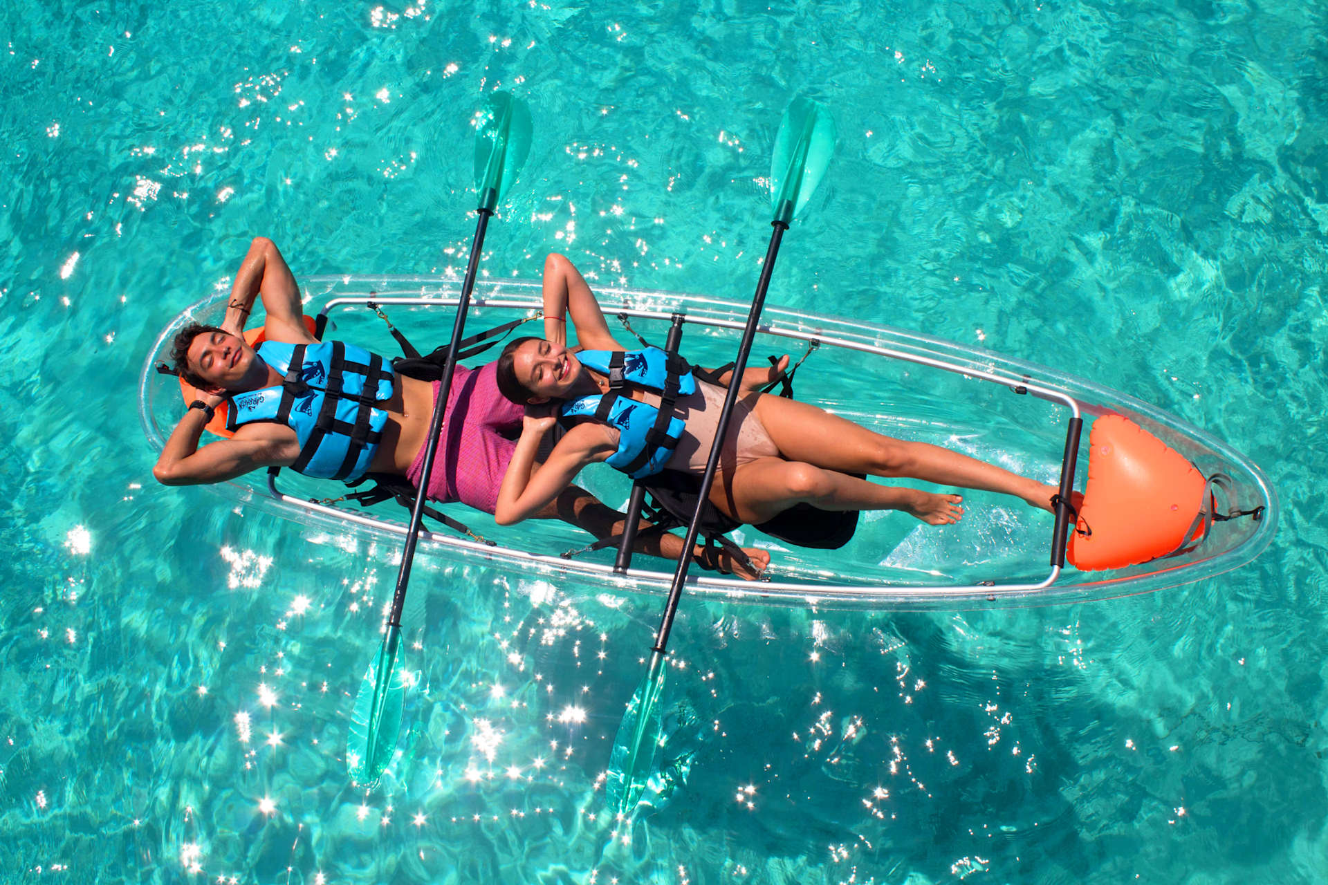 Couple on Clear Boat at Royal Garrafon Natural Reef Park