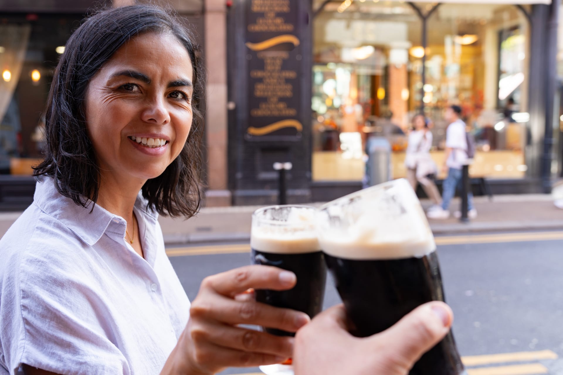 Woman drinking Guinness in Dublin