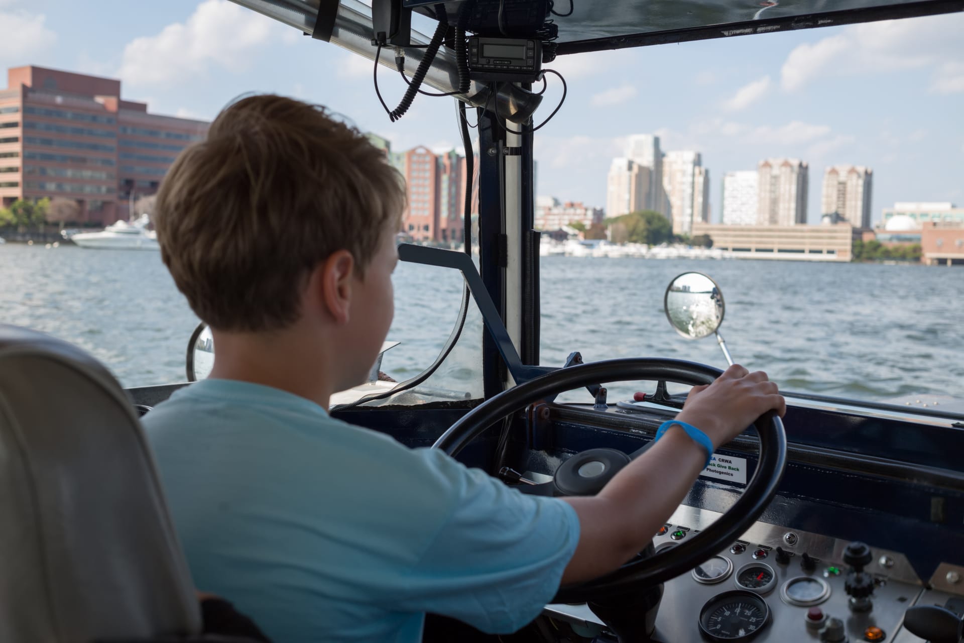 Child driving the Boston Duck Boat