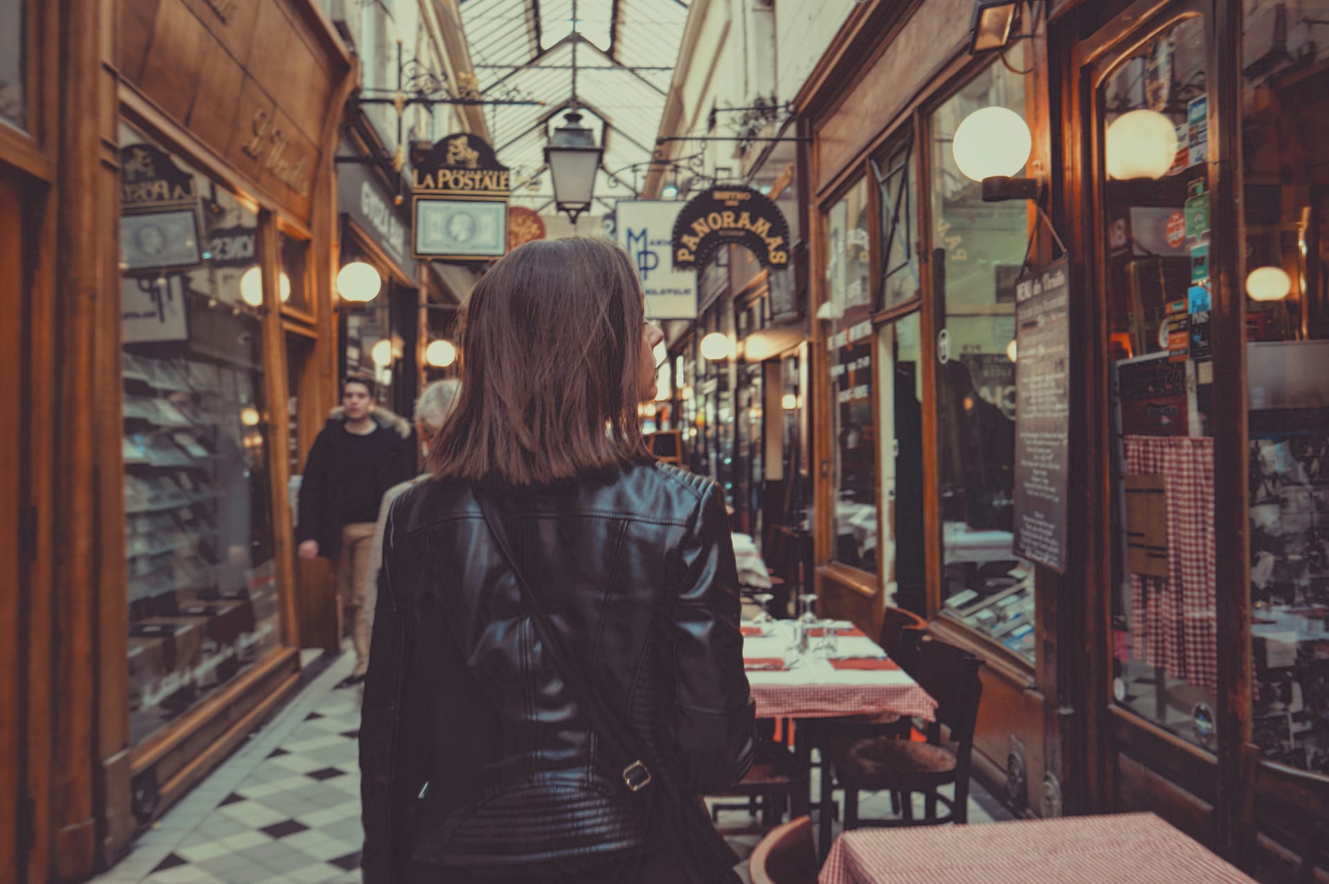 Woman looking at shops in Paris