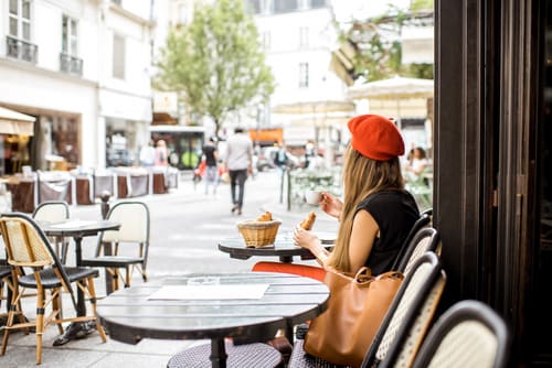 Woman in beret at Parisian cafe