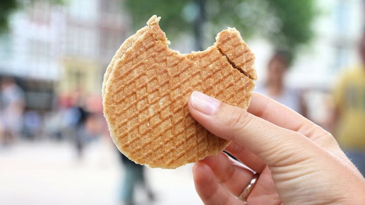 Traditional Dutch stroopwafel with a bite taken out of it