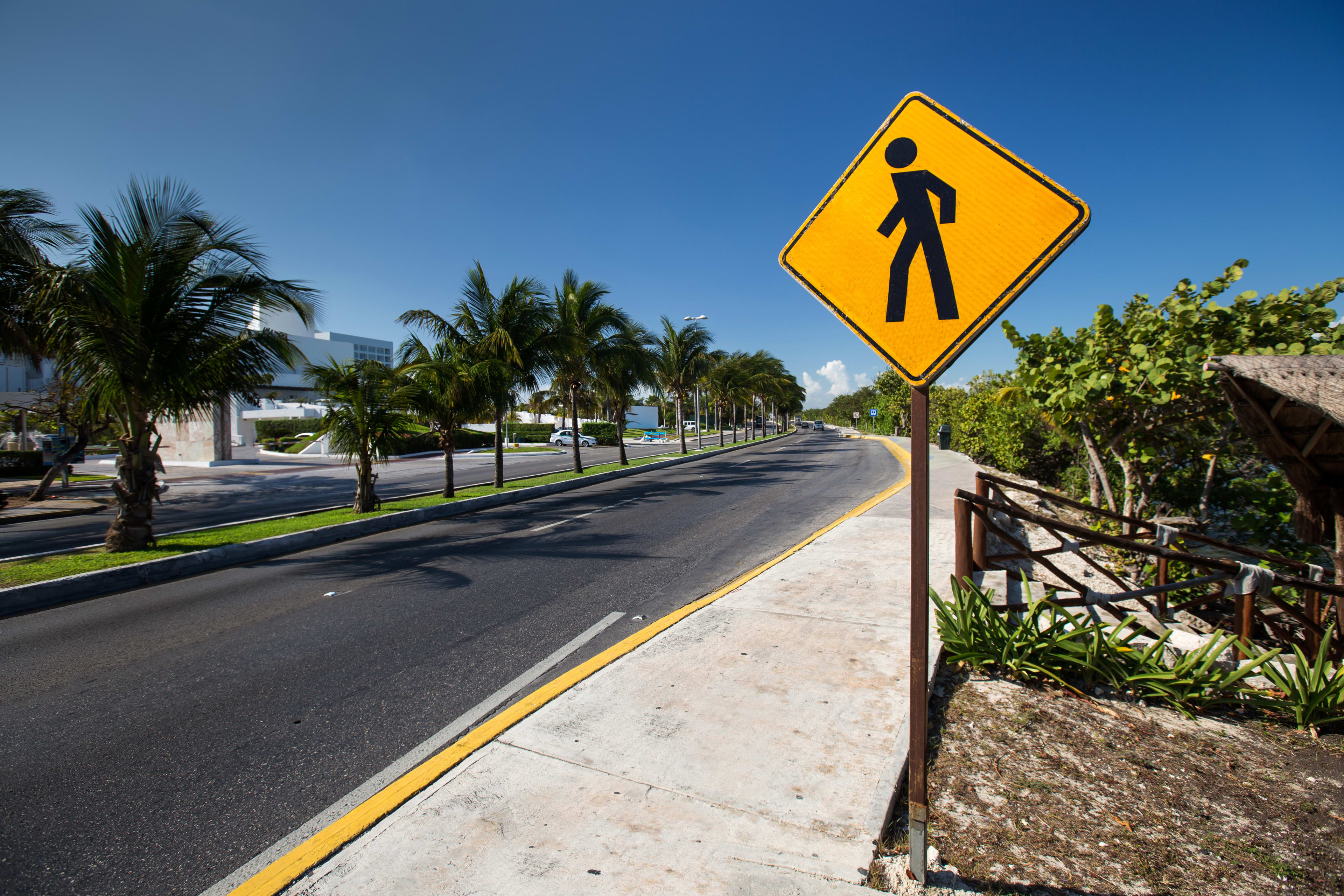 Cancun street and walking street sign