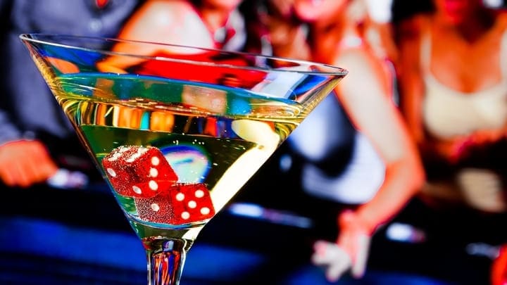 Cocktail glass containing red dice in a Las Vegas casino