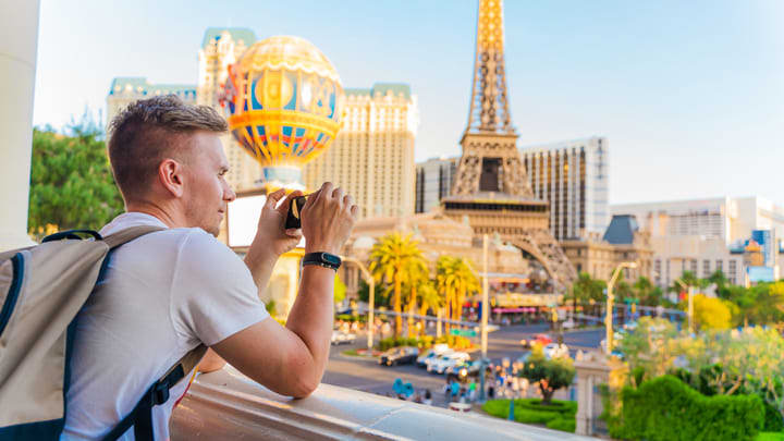 Tourist taking photographs on the Las Vegas Strip