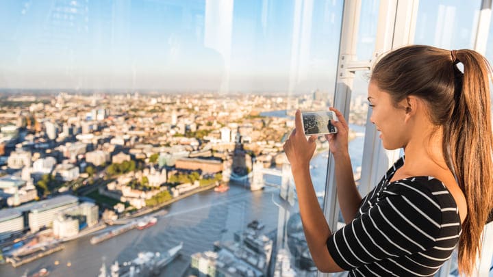 Woman taking a photograph at The View from The Shard