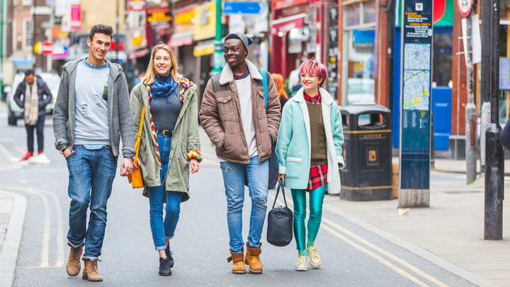 Group of friends walking along Brick Lane