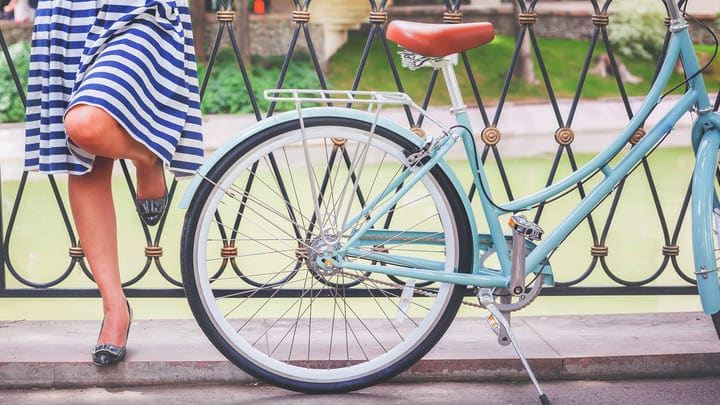 Chic lady with bicycle in Paris