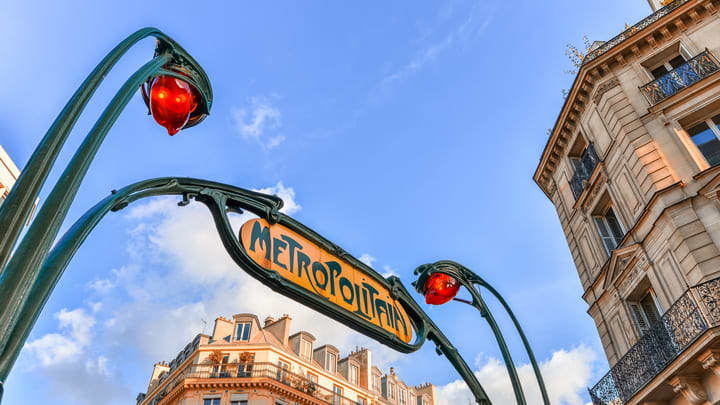 Old-fashioned sign over an entrance to the Paris Métro