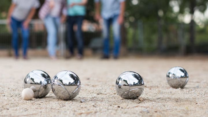 Family playing pétanque in Paris