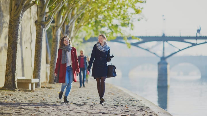 Women walking by the canal in Paris