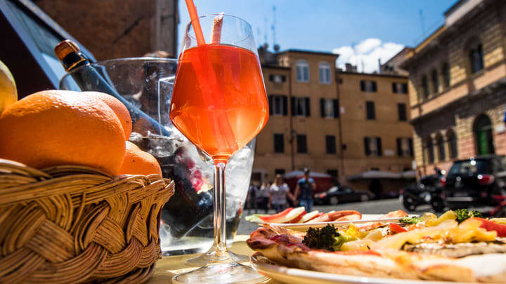 Campari cocktail and tapas on a piazza in Rome