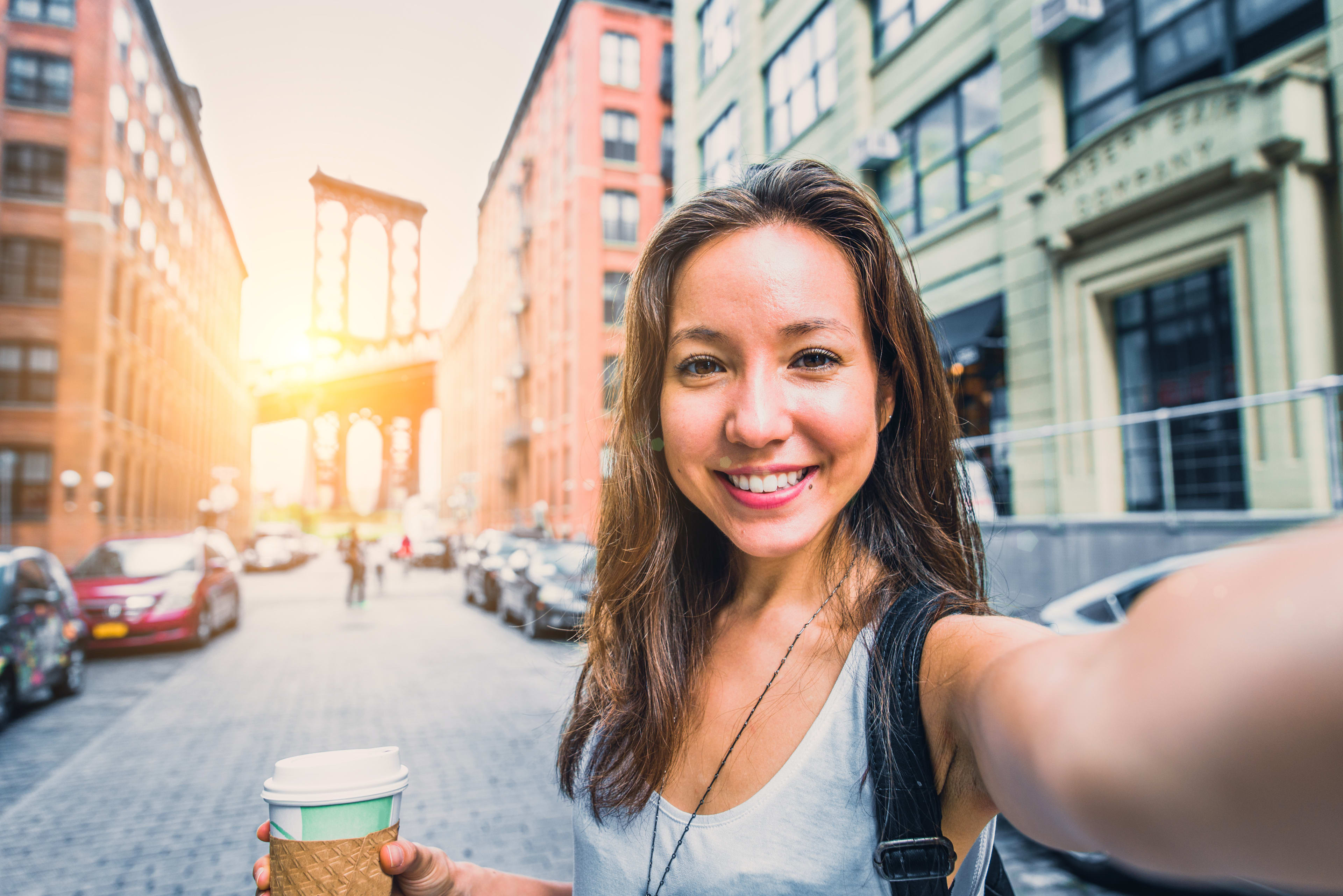 Smiling woman taking selfie in New York