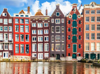 Iconic Amsterdam canal houses reflected in a canal