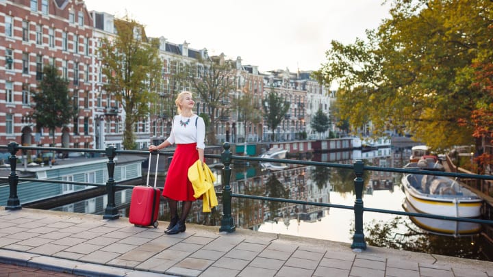 Image of City, Water, Waterfront, Skirt, Boat, Vehicle, Adult, Female, Person, Woman, Bag, Handbag, Neighborhood, Walking, Urban, Photography, 