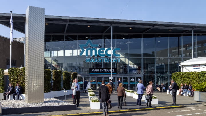 Image of Convention Center, Handbag, Person, Airport, Coat, Plant, Walking, Urban, 