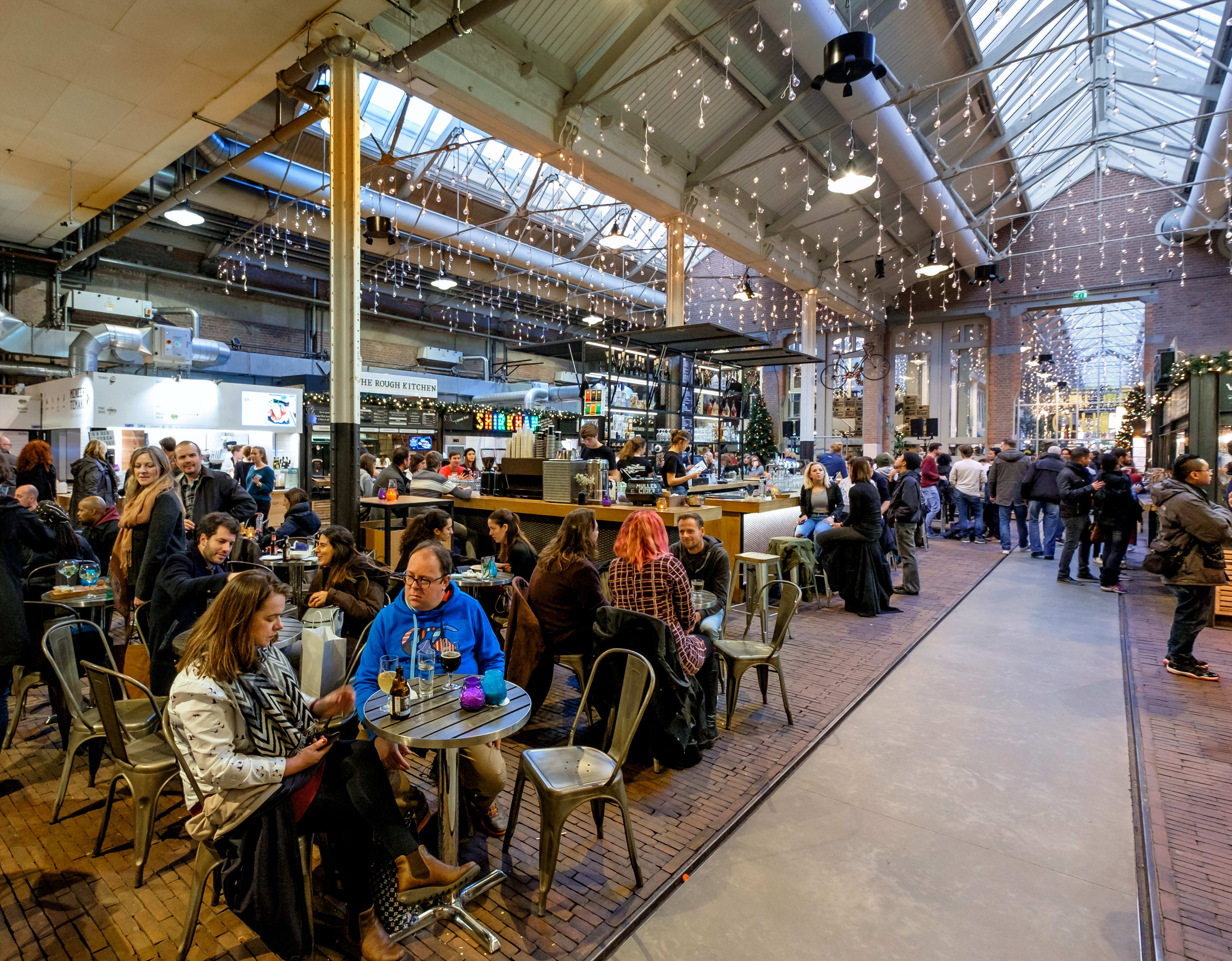 Image of Indoors, Restaurant, Cafeteria, Adult, Female, Person, Woman, Building, Urban, Food, Food Court, Cafe, Chair, Furniture, Lounge, 