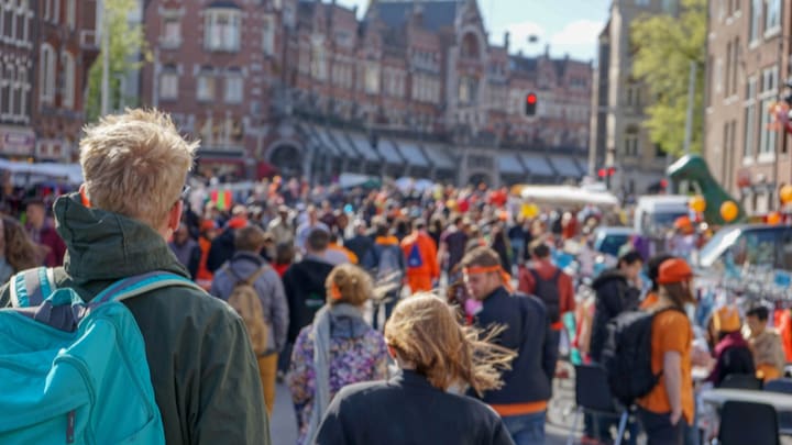 Image of Boy, Male, Person, Teen, Adult, Female, Woman, Backpack, People, Crowd, City, Man, Urban, Traffic Light, Parade, 