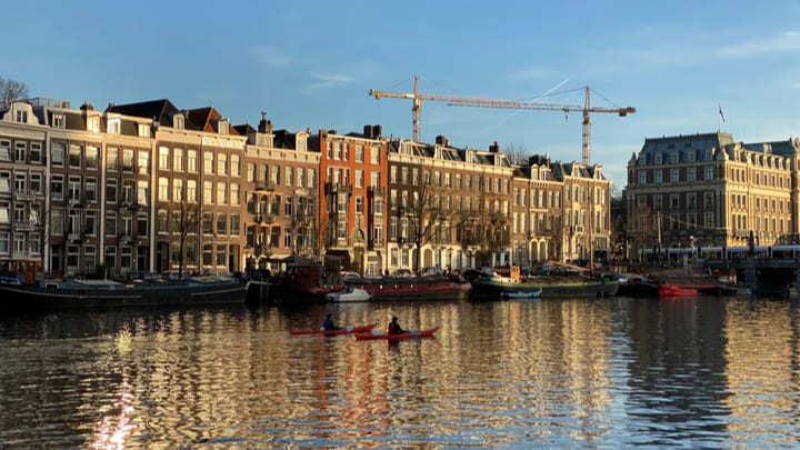 Image of Water, Waterfront, City, Metropolis, Urban, Vehicle, Watercraft, Neighborhood, Cityscape, Port, Construction, Construction Crane, Boat, Harbor, Pier, 