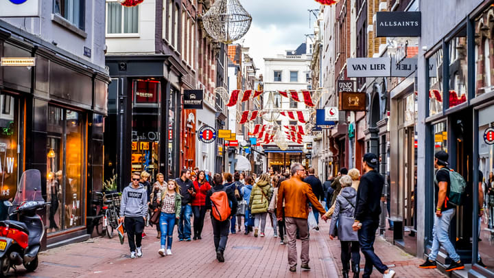 Image of Urban, City, Person, Adult, Male, Man, People, Backpack, Bag, Pedestrian, Traffic Light, Road, Street, Bicycle, Handbag, Motorcycle, 