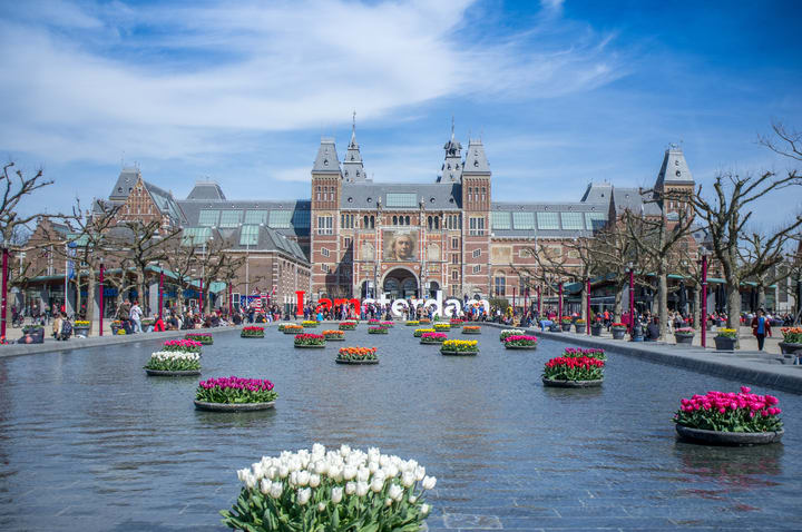 Image of City, Urban, Plant, Boat, Person, Downtown, Flower, Clock Tower, Tower, 